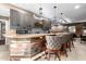 Home bar featuring a wooden countertop, brick accents, pendant lighting, and a flatscreen TV at 9310 S Bala Dr, Tempe, AZ 85284
