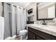Bathroom with shower, vanity, and a dark wood cabinet at 9310 S Bala Dr, Tempe, AZ 85284