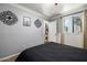 Bedroom with a doorway to the closet, offering access to storage for clothes and accessories at 9310 S Bala Dr, Tempe, AZ 85284