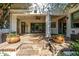 Charming covered patio with stone flooring, decorative flower pots, and access to indoor living spaces at 9310 S Bala Dr, Tempe, AZ 85284