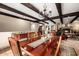 Open dining space with beamed ceilings and access to living spaces, ideal for entertaining Gathering and friends at 9310 S Bala Dr, Tempe, AZ 85284