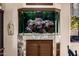 Built in fish tank on top of a cabinet in a dining area is an eye-catching feature at 9310 S Bala Dr, Tempe, AZ 85284