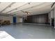 Spacious garage featuring ample storage cabinets and an epoxy-coated floor at 9310 S Bala Dr, Tempe, AZ 85284