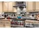 Kitchen features modern appliances, granite countertops, and custom tile backsplash at 9310 S Bala Dr, Tempe, AZ 85284
