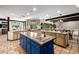 Open kitchen layout with an island sink and countertops with beautiful views of the outside at 9310 S Bala Dr, Tempe, AZ 85284
