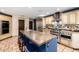 Bright kitchen features a large island, stainless steel appliances, and tile backsplash at 9310 S Bala Dr, Tempe, AZ 85284
