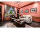 Charming living room with cozy seating, window views and a patterned area rug, creating a warm ambiance at 9310 S Bala Dr, Tempe, AZ 85284