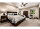 Comfortable bedroom with plush carpets, large windows, and ample space and storage at 9310 S Bala Dr, Tempe, AZ 85284