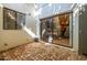 Back patio with sliding glass door offers easy access to the interior, blending indoor and outdoor living spaces at 9310 S Bala Dr, Tempe, AZ 85284