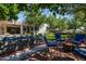 Spacious outdoor living area featuring a fire pit, brick pavers and ample seating for guests at 9310 S Bala Dr, Tempe, AZ 85284
