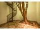 Unique outdoor space with a spiral staircase and a decorated tree, creating a magical ambiance at 9310 S Bala Dr, Tempe, AZ 85284