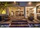 Inviting covered patio with stone flooring, decorative flower pots, and open views to the home's interior at 9310 S Bala Dr, Tempe, AZ 85284