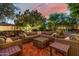 Entertain in this covered patio area with ample comfortable seating and a charming brick floor at 9310 S Bala Dr, Tempe, AZ 85284