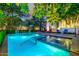 This elegant backyard has a refreshing pool and spa, surrounded by lush landscaping and patio furniture at 9310 S Bala Dr, Tempe, AZ 85284