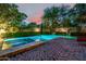 Refreshing backyard pool and spa with beautiful stonework and an expansive brick patio for entertaining at 9310 S Bala Dr, Tempe, AZ 85284