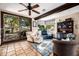 Bright sunroom features comfortable seating and views of the outdoor patio, ideal for relaxation and enjoyment at 9310 S Bala Dr, Tempe, AZ 85284