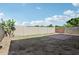Large backyard offering ample space, enclosed by a block fence for privacy and security at 9420 S 35Th Gln, Laveen, AZ 85339