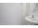 Powder room featuring a pedestal sink, updated fixtures, and neutral paint at 9420 S 35Th Gln, Laveen, AZ 85339