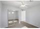 Bedroom with mirrored closet doors, new carpet, and ceiling fan at 9420 S 35Th Gln, Laveen, AZ 85339
