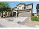 Charming two-story home featuring a two-car garage and well-maintained landscaping at 9420 S 35Th Gln, Laveen, AZ 85339