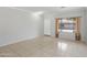 Inviting living room featuring neutral paint, tile floors, and large window with lots of light at 9420 S 35Th Gln, Laveen, AZ 85339