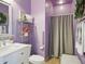 Comfortable full bathroom complete with vanity, toilet, shower, and decorative shelving and fixtures at 10010 W Illini St, Tolleson, AZ 85353