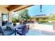 Inviting backyard features an outdoor dining area and a pool in a well-maintained outdoor living space at 10440 W Swayback Pass, Peoria, AZ 85383
