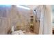 Tiled bathroom shower with seating and a shower caddy at 10440 W Swayback Pass, Peoria, AZ 85383