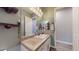 Well-lit bathroom featuring a vanity with a mirror, modern fixtures, and a separate toilet area at 10440 W Swayback Pass, Peoria, AZ 85383