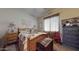 Cozy bedroom featuring a wooden bed frame, vintage trunk, and decorative macrame wall hanging at 10440 W Swayback Pass, Peoria, AZ 85383