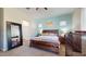 Comfortable bedroom with ample natural light, carpet floors, and a light blue accent wall at 10440 W Swayback Pass, Peoria, AZ 85383