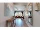 Inviting hallway leads to a living area, enhanced by a wood console table and tile flooring at 10440 W Swayback Pass, Peoria, AZ 85383