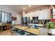 Kitchen island with bar seating and stainless steel appliances at 10440 W Swayback Pass, Peoria, AZ 85383