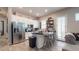 Modern kitchen featuring stainless steel appliances and an island with bar seating at 10440 W Swayback Pass, Peoria, AZ 85383