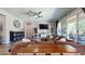 Spacious living room with ceiling fan, a large TV, and sliding glass doors to the outside at 10440 W Swayback Pass, Peoria, AZ 85383