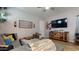 Comfortable living room features stylish decor, ceiling fan, and a large-screen television for entertainment at 10440 W Swayback Pass, Peoria, AZ 85383
