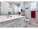 Modern bathroom with a double vanity, tile floors, and a clean, well-lit space at 1202 E Nolan Pl, Chandler, AZ 85249