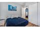 Cozy bedroom with a scenic art piece, full-length mirror, and closet with sliding doors at 1202 E Nolan Pl, Chandler, AZ 85249