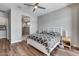 Bedroom with ceiling fan featuring an ensuite bathroom with a glass walk-in shower at 1202 E Nolan Pl, Chandler, AZ 85249