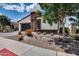 This home features desert landscaping, a modern garage door, and neutral colors at 1202 E Nolan Pl, Chandler, AZ 85249