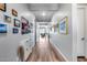 Long hallway with light flooring and picture frames at 1202 E Nolan Pl, Chandler, AZ 85249