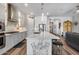 Kitchen island with barstool seating, stainless steel appliances, and modern cabinets at 1202 E Nolan Pl, Chandler, AZ 85249