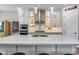 Kitchen featuring an island with barstool seating, stainless steel appliances, and modern cabinets at 1202 E Nolan Pl, Chandler, AZ 85249