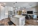 Bright open concept kitchen with a large island, stainless steel appliances, and views to the living room at 1202 E Nolan Pl, Chandler, AZ 85249