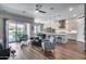 Open-concept living space featuring wood flooring, modern decor, and kitchen with large island at 1202 E Nolan Pl, Chandler, AZ 85249