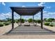 Shaded pergola with benches, creating a relaxing and inviting community gathering space outdoors at 1202 E Nolan Pl, Chandler, AZ 85249