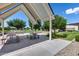 Inviting outdoor seating area with picnic tables under a shaded pavilion in a community park setting at 1202 E Nolan Pl, Chandler, AZ 85249
