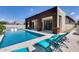 Inviting pool featuring a covered patio with outdoor seating, perfect for relaxation and entertaining at 1202 E Nolan Pl, Chandler, AZ 85249