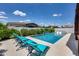 Backyard pool with lounge chairs, landscape, and outdoor living at 1202 E Nolan Pl, Chandler, AZ 85249