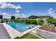 Backyard pool with landscaping, built-in loungers, and seating at 1202 E Nolan Pl, Chandler, AZ 85249